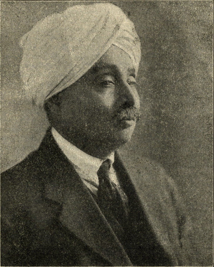Archival halftone portrait photograph of Lala Lajpat Rai in a white turban, moustache and dark suit, reproduced in his book Young India