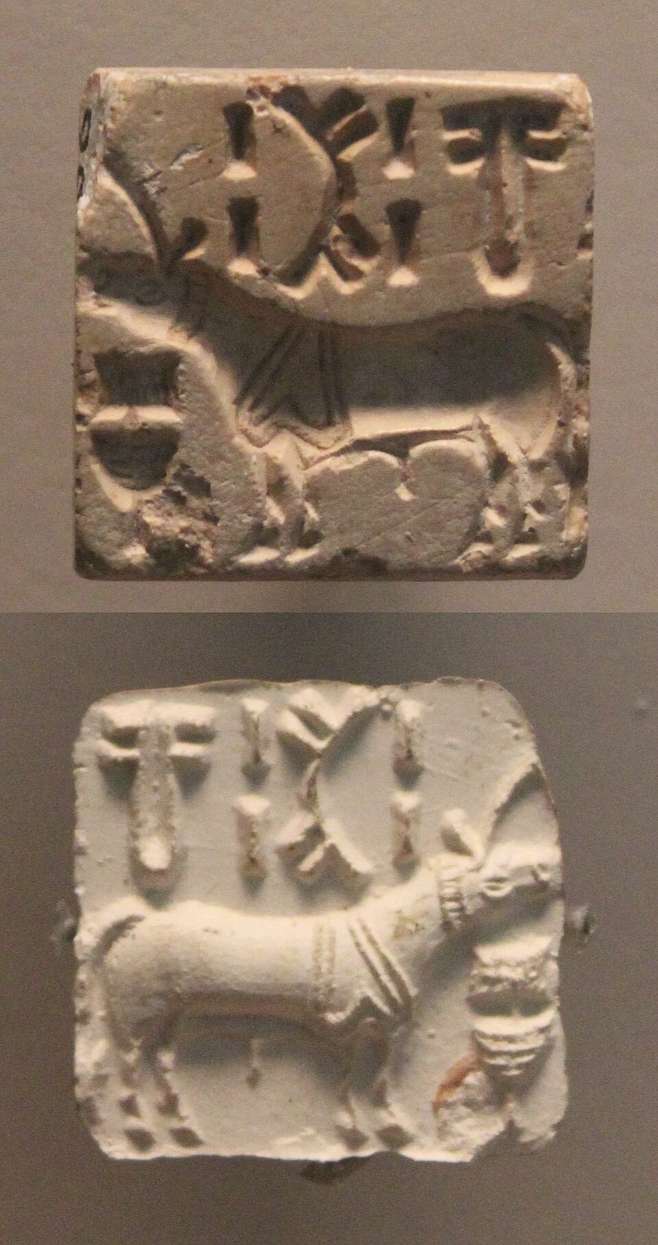 An Indus Valley steatite seal shown above its clay impression, each carved with a one-horned bull-like animal below a short line of Indus script signs