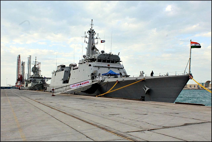 The Indian Navy offshore patrol vessel INS Sunayna moored alongside a quay with the Indian ensign flying at her stern