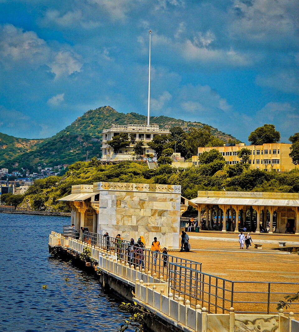 The marble baradari pavilion on the embankment of Ana Sagar lake at Ajmer, with the lake at left and the Aravalli hills behind