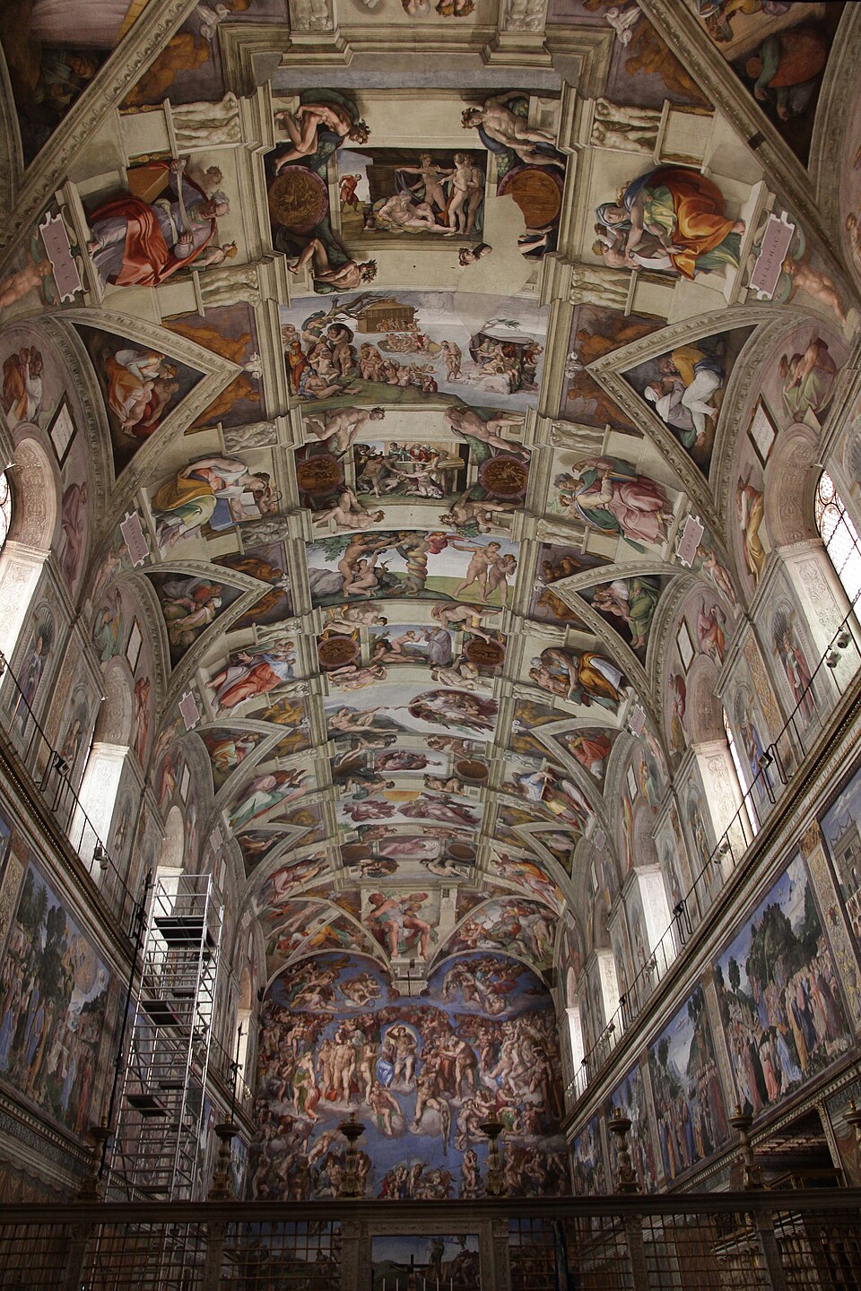 The frescoed barrel vault of the Sistine Chapel in the Vatican, looking up the length of the chapel towards Michelangelo's Last Judgement on the altar wall.