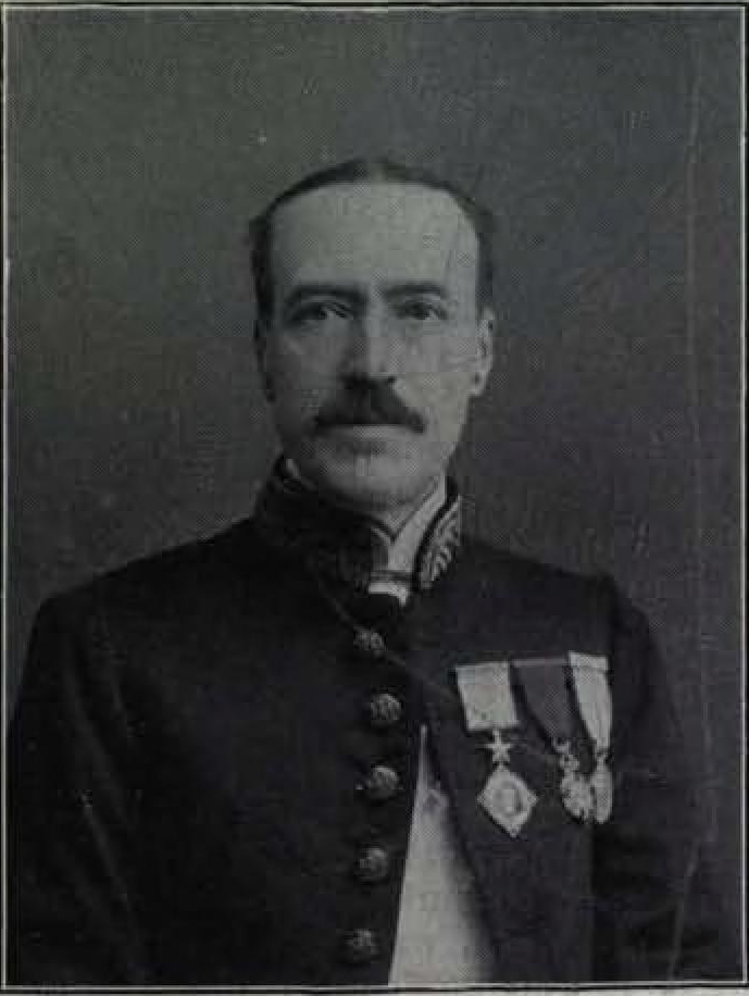 A black-and-white portrait of the colonial administrator Herbert Hope Risley in a dark buttoned uniform coat with two medals on his chest.