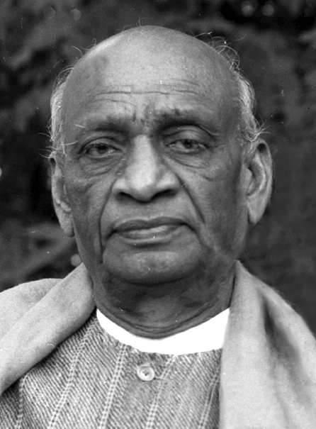 A black-and-white head-and-shoulders portrait of Sardar Vallabhbhai Patel, bald and clean-shaven, wearing a kurta with a shawl over one shoulder.