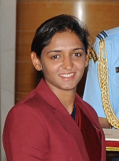 Portrait of Indian cricketer Harmanpreet Kaur in a maroon blazer at the 2017 Arjuna Award ceremony at Rashtrapati Bhavan, New Delhi.