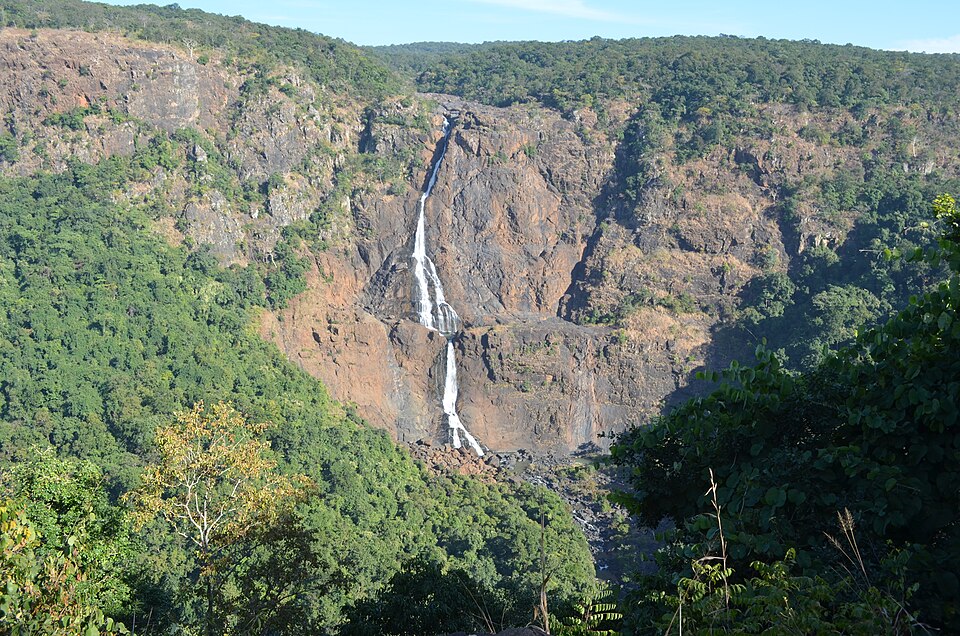 Barehipani Falls dropping in two long white steps down a rocky cliff inside the forested hills of the Simlipal Biosphere Reserve in Odisha.