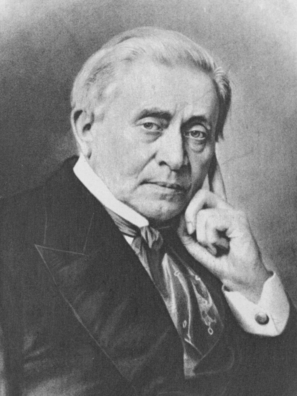 A black-and-white portrait of the elderly American physicist Joseph Henry, white-haired and in a dark coat and cravat, resting his cheek on one hand.