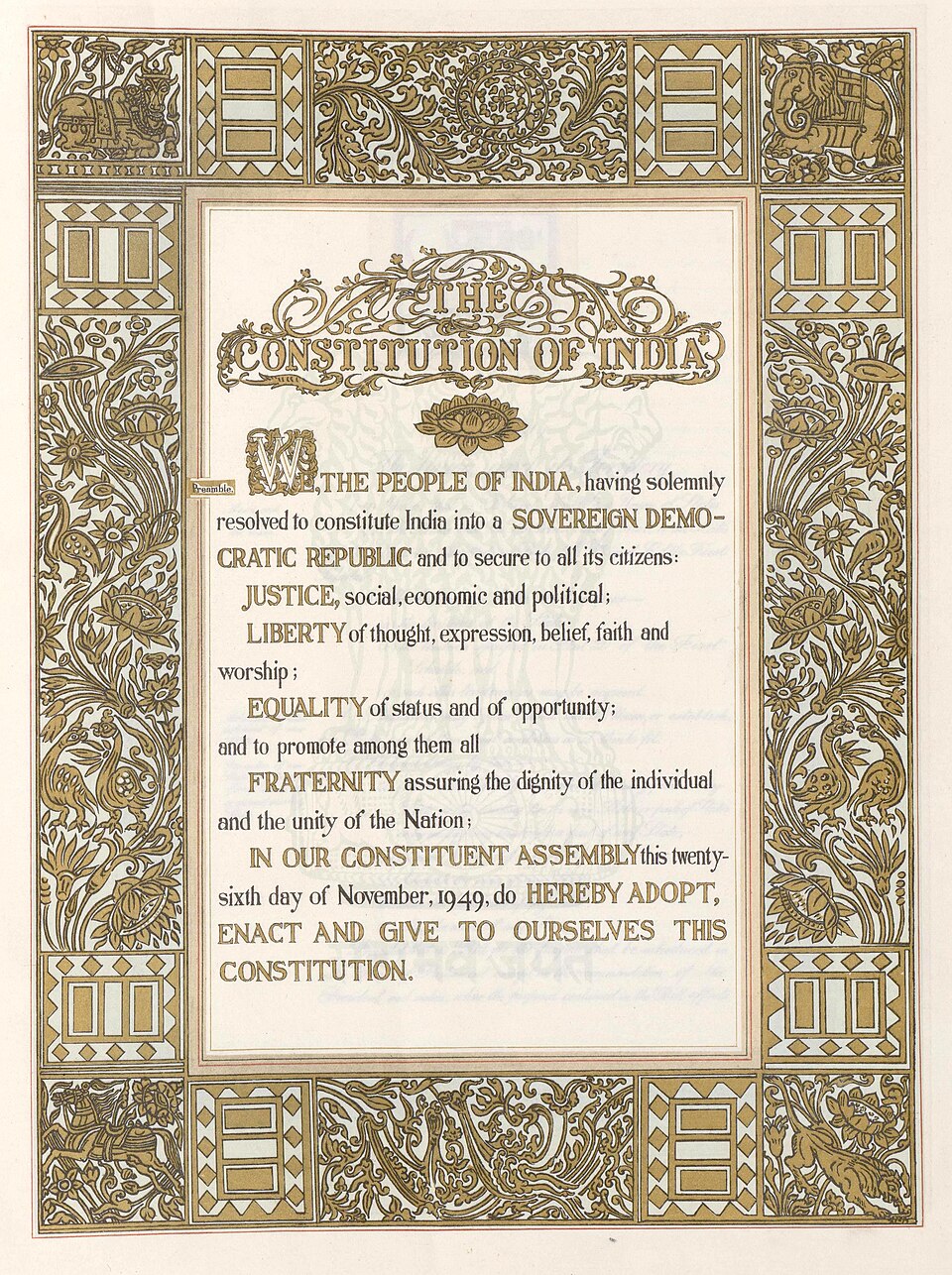 The hand-lettered Preamble page of the Constitution of India, its text beginning WE, THE PEOPLE OF INDIA set inside a gold-illuminated decorative border.