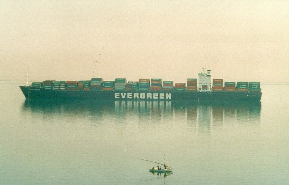 A large Evergreen container ship transiting the Suez Canal, Egypt.