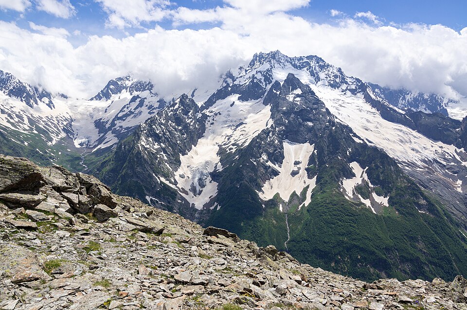 Snow-capped peaks and a glacier of the Caucasus Mountains between the Black and Caspian Seas
