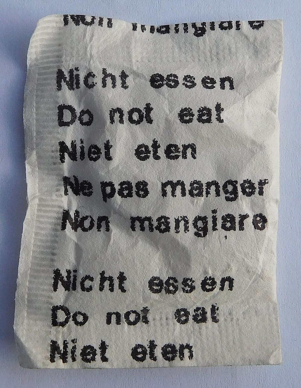 A 'Do not eat' silica gel desiccant sachet of the kind packed with medicines and electronics
