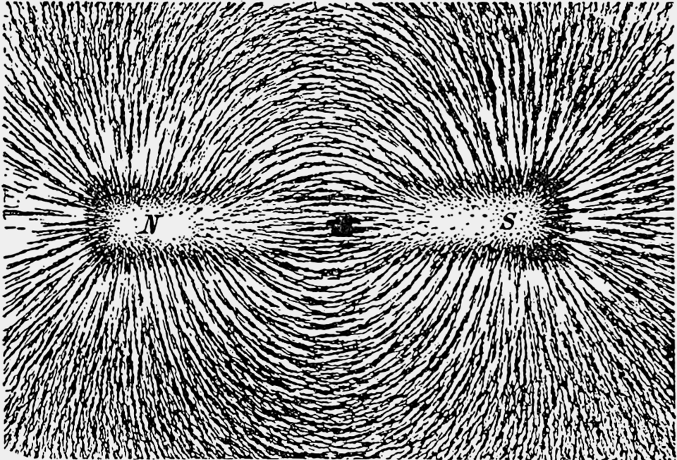 Iron filings tracing the magnetic field loops from the north to the south pole of a bar magnet