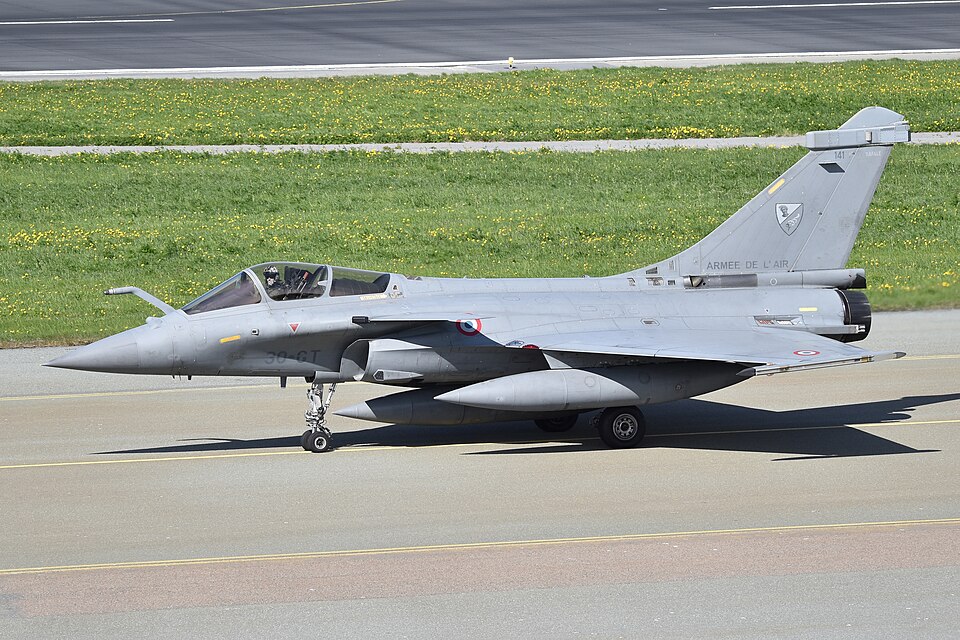A French Air Force Dassault Rafale multirole fighter jet in side profile on the tarmac