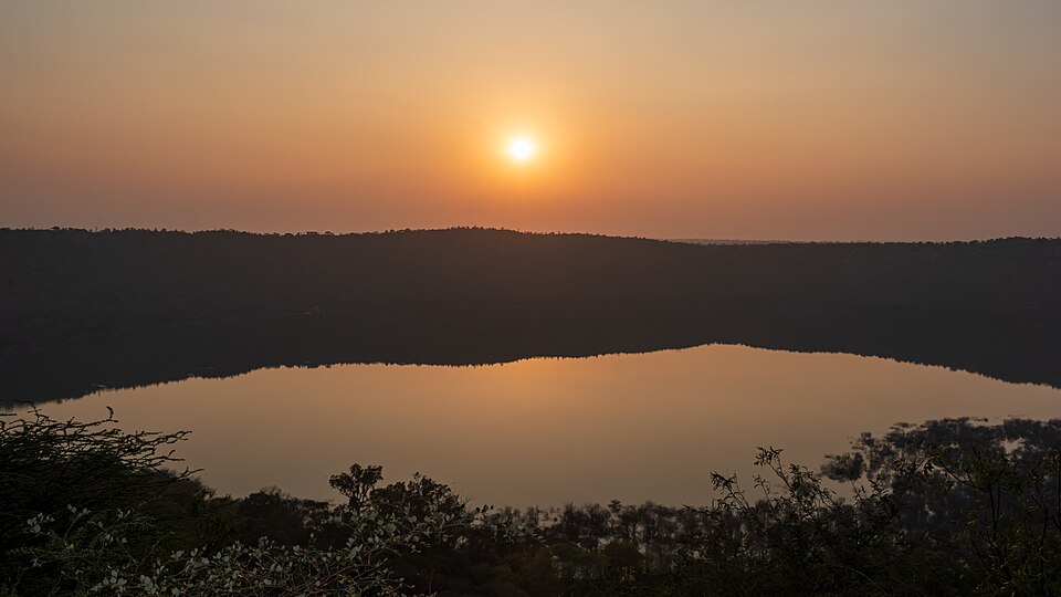 Near-circular Lonar meteorite-impact crater lake ringed by forest, Maharashtra