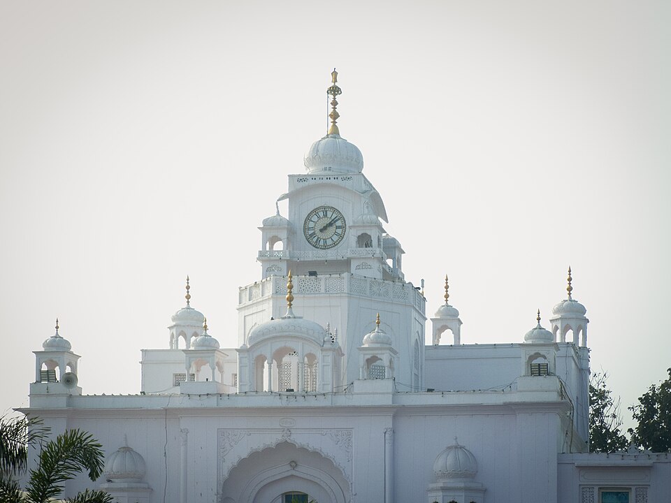 The white domed Gurudwara Fatehgarh Sahib, Punjab, with its central clock tower