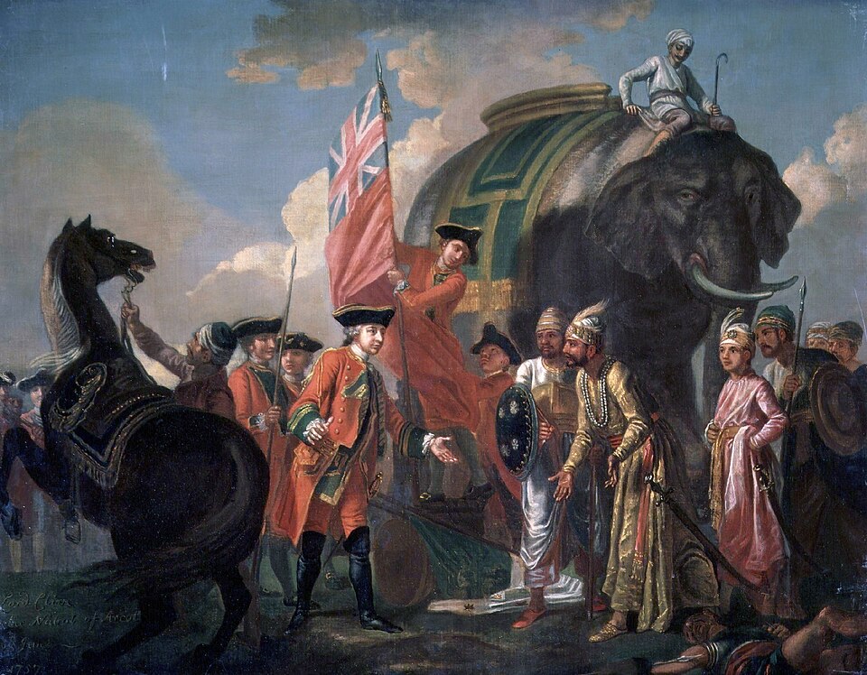 Francis Hayman's oil painting of Robert Clive in red uniform extending his hand to Mir Jafar and his retinue after the Battle of Plassey, with the British colours, a rearing horse and a caparisoned elephant behind them.