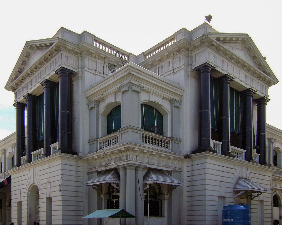 The white neoclassical Fort St George building in Chennai, with rows of dark columns under triangular pediments, which today houses the Tamil Nadu Legislative Assembly and Secretariat.