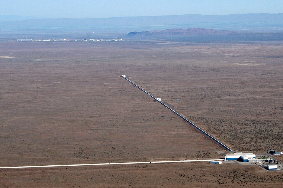 Aerial view of the LIGO Hanford gravitational-wave observatory showing a kilometre-long interferometer arm