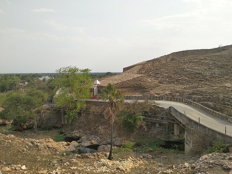 The ancient Cyclopean Wall of Rajgir - a long rampart of massive undressed stones running along a hillside, part of the fortification around old Rajagriha, Bihar