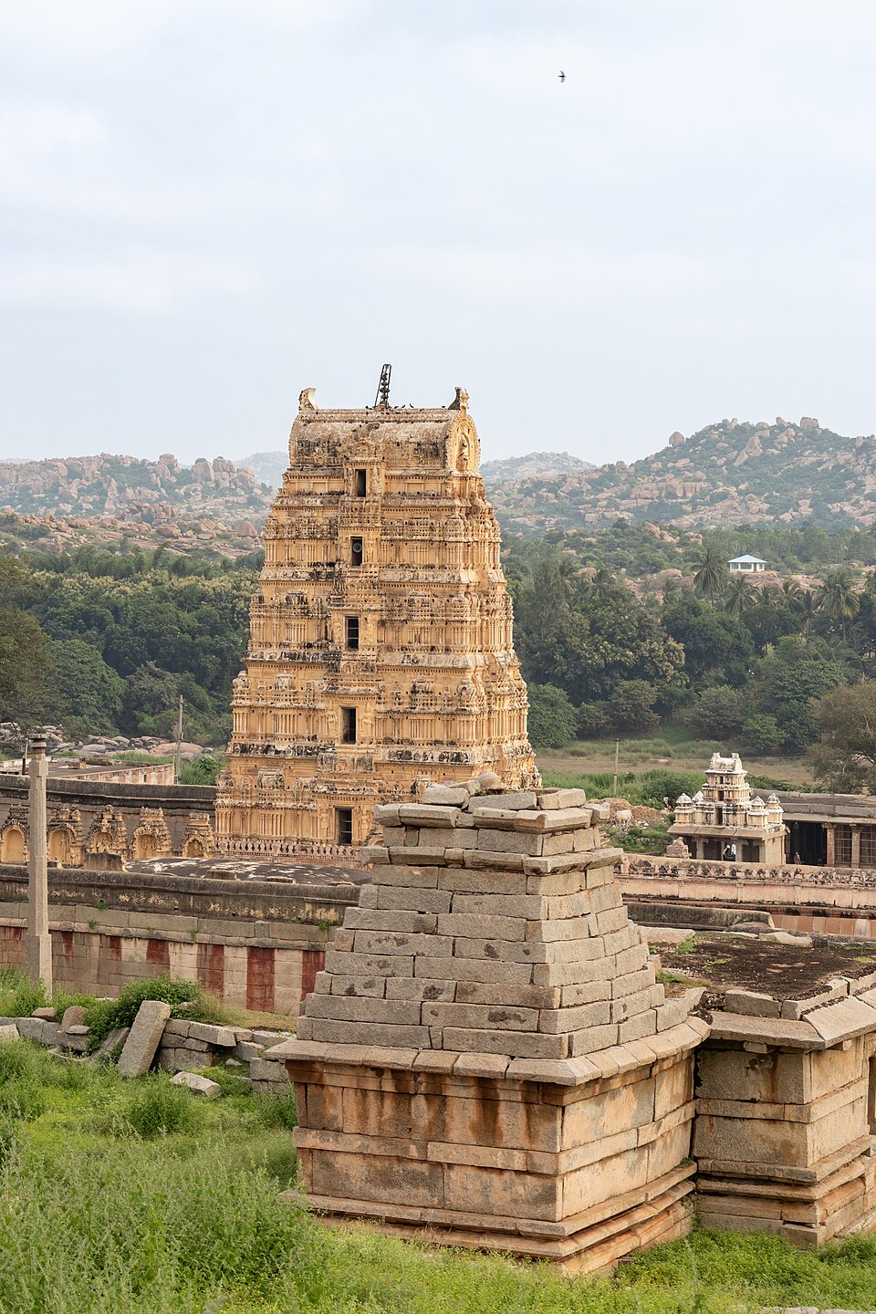 Tall stone gopuram tower of the Virupaksha Temple complex at Hampi