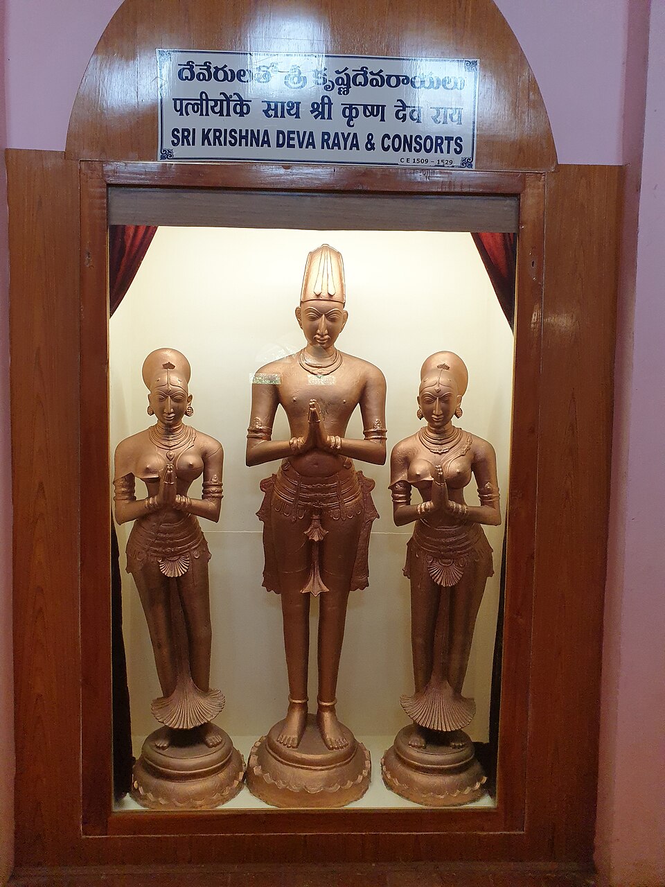 Bronze statues of Krishnadeva Raya flanked by his two queens in devotional posture