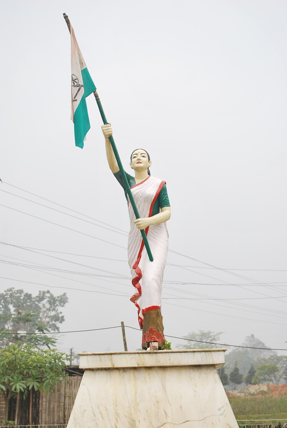 Statue of freedom fighter Kanaklata Barua raising the national flag