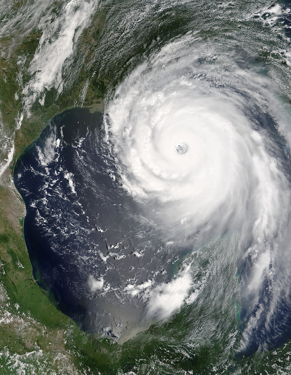 Satellite image of Hurricane Katrina over the Gulf of Mexico, its rainbands spiralling counter-clockwise around the eye