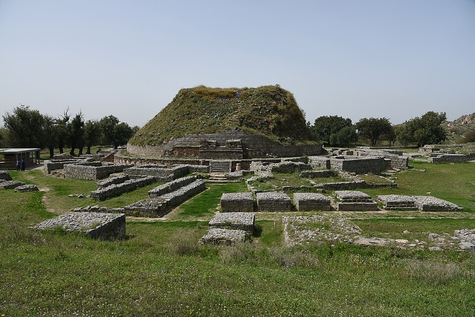 The Dharmarajika Stupa, a large Buddhist mound surrounded by monastic ruins at Taxila (Takshashila)