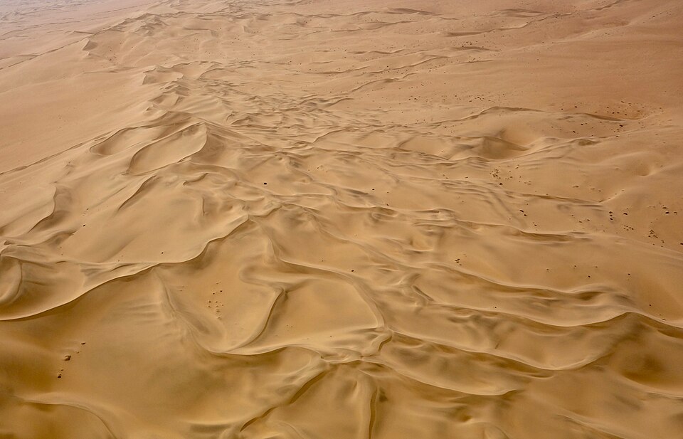 Aerial view of arid sand dunes in the Namib Desert near Namibia's Skeleton Coast