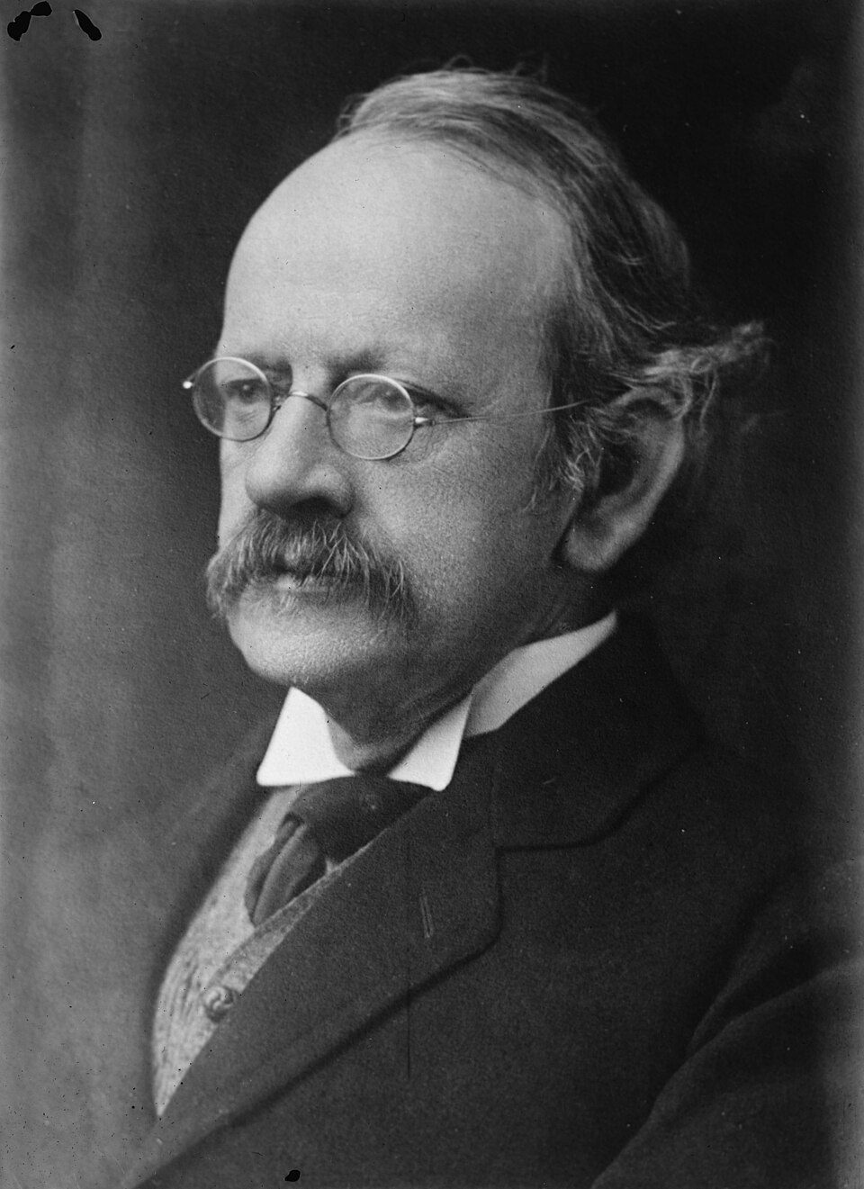 Portrait photograph of physicist J. J. Thomson, discoverer of the electron, in spectacles and moustache