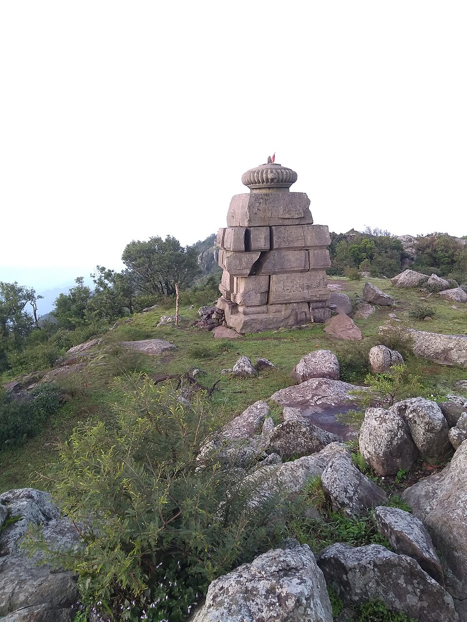 The dry-stone Bhima temple standing on the granite, grass and forest summit of Mahendragiri in Gajapati district, Odisha
