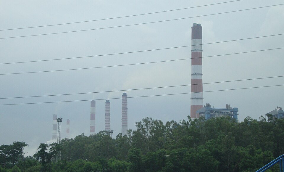 Tall red-and-white banded chimney stacks of the Vindhyachal Super Thermal Power Station