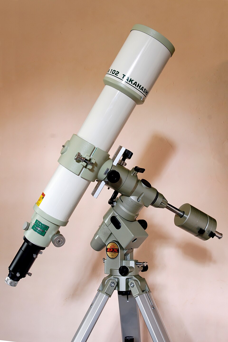 A refracting telescope mounted on an equatorial tripod