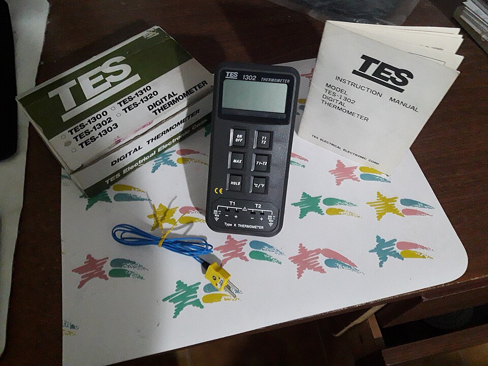 A digital thermometer with a Type-K thermocouple probe