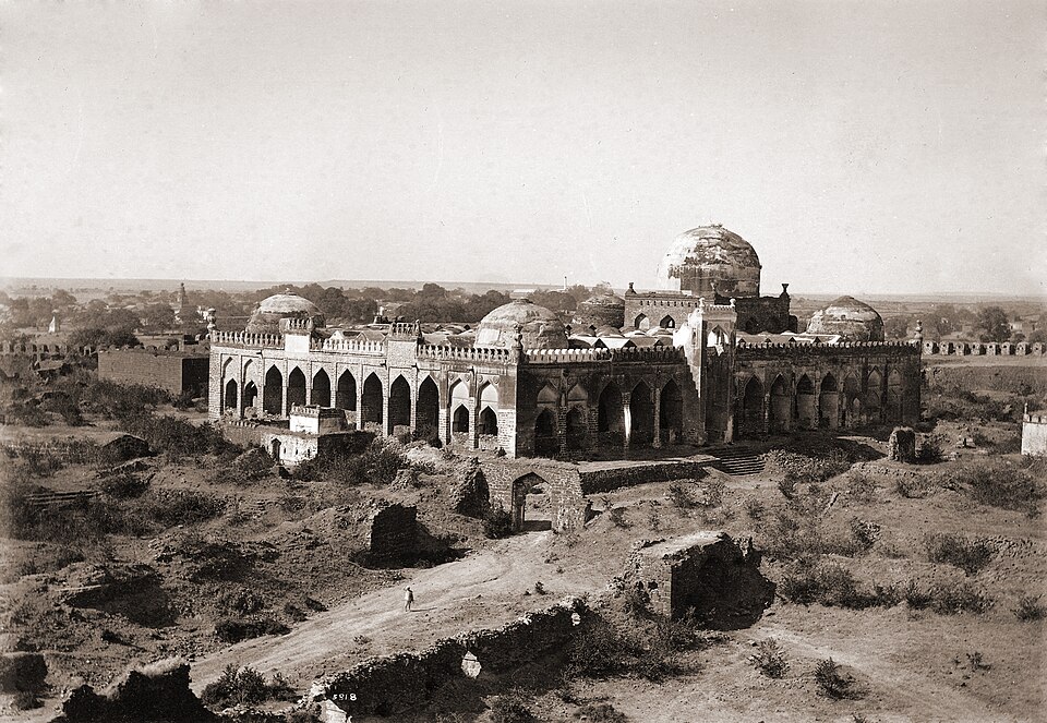 The domed and arched Great Mosque (Jama Masjid) inside Gulbarga Fort, seen across the fort ramparts