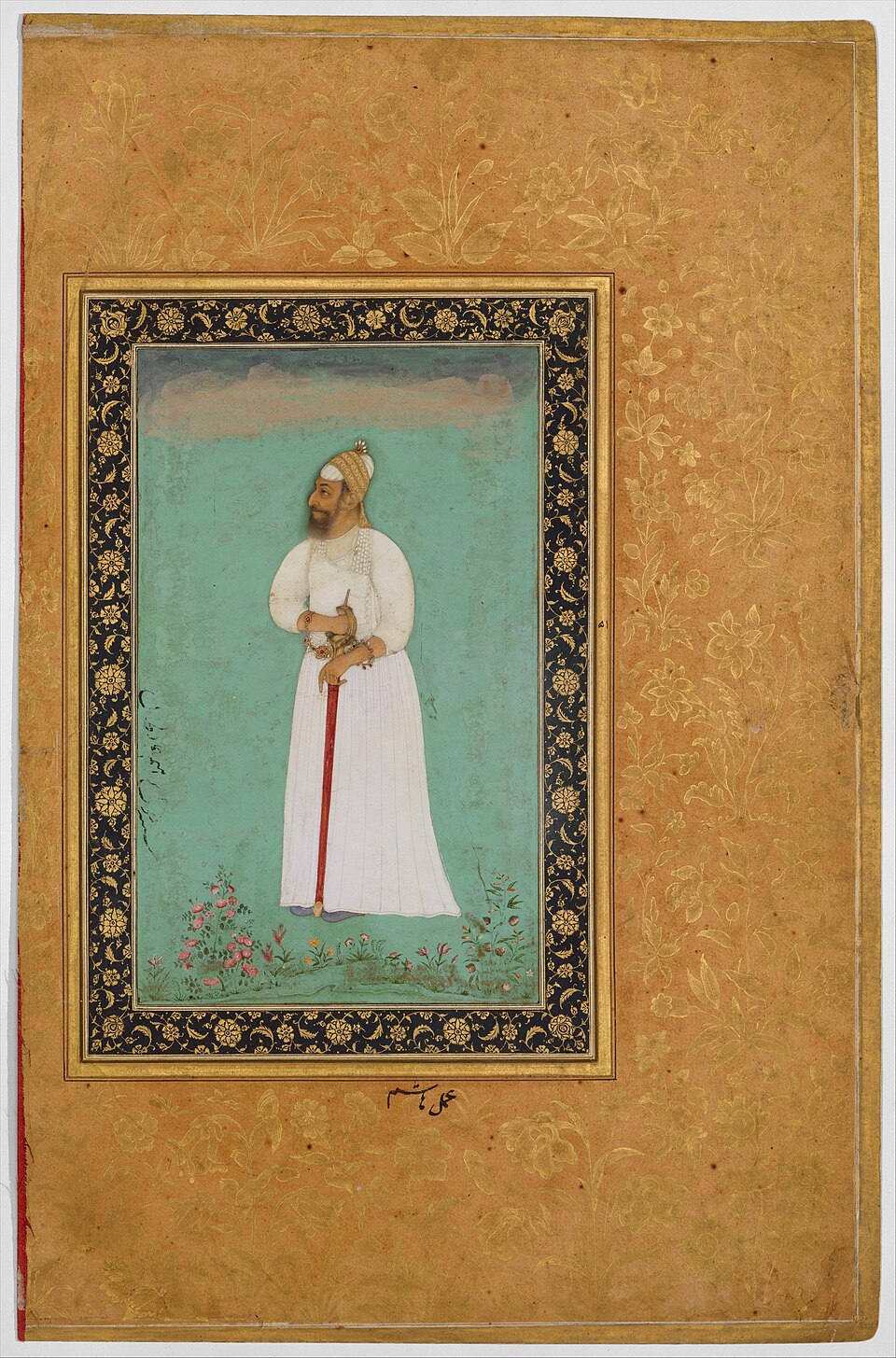 Mughal-era miniature portrait of Ibrahim Adil Shah II of Bijapur standing in profile in white robes and a jeweled turban, holding a red-hilted sword, on a green ground within a gold floral border