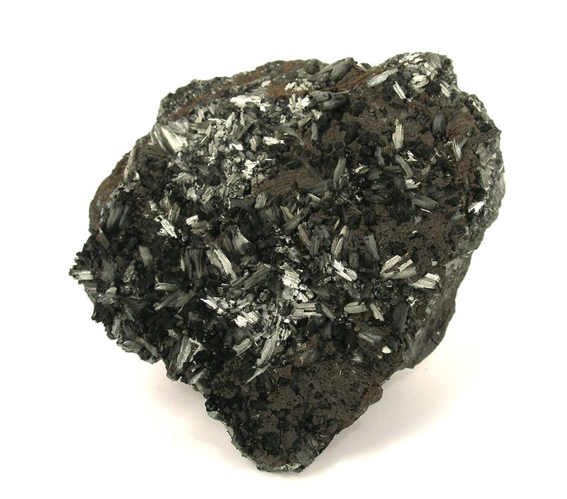 A dark grey-black mineral specimen of pyrolusite, a manganese ore, with metallic radiating crystal blades on its surface