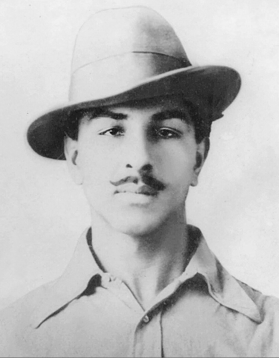 A black-and-white studio portrait of a young man wearing a wide-brimmed felt hat (Bhagat Singh, 1929).