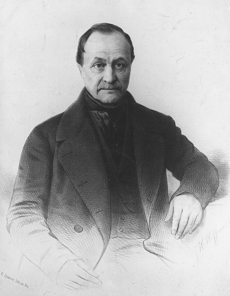 A 19th-century lithograph portrait of the French sociologist Auguste Comte, a clean-shaven man in a dark coat seated with one hand raised toward his face.