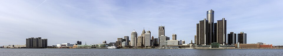 Panorama of the Detroit skyline seen across the river, the cylindrical towers of the General Motors Renaissance Center rising at the right