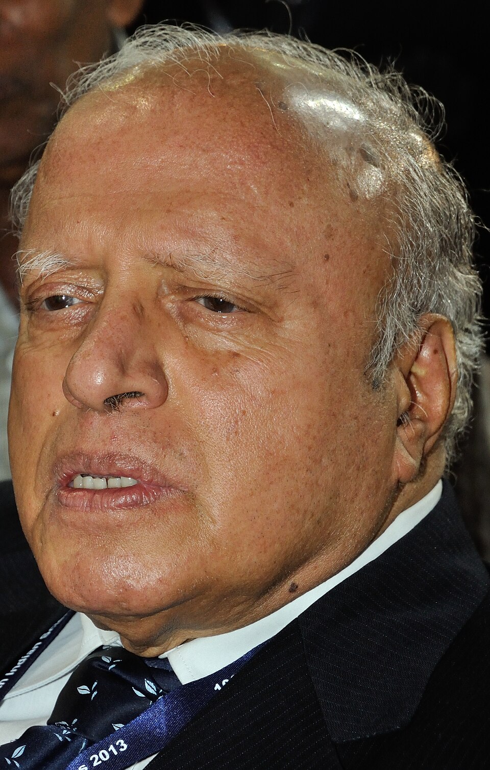 Close-up portrait of the elderly agricultural scientist M. S. Swaminathan in a dark suit and patterned tie