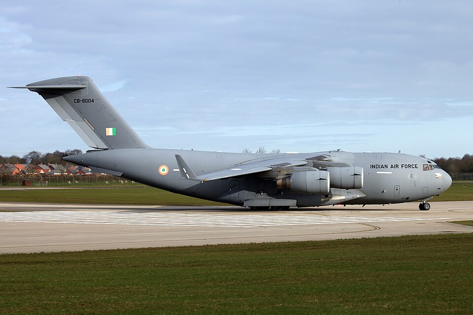 A grey Indian Air Force C-17 Globemaster III transport aircraft, serial CB-8004, on a taxiway with the Indian roundel on its fuselage