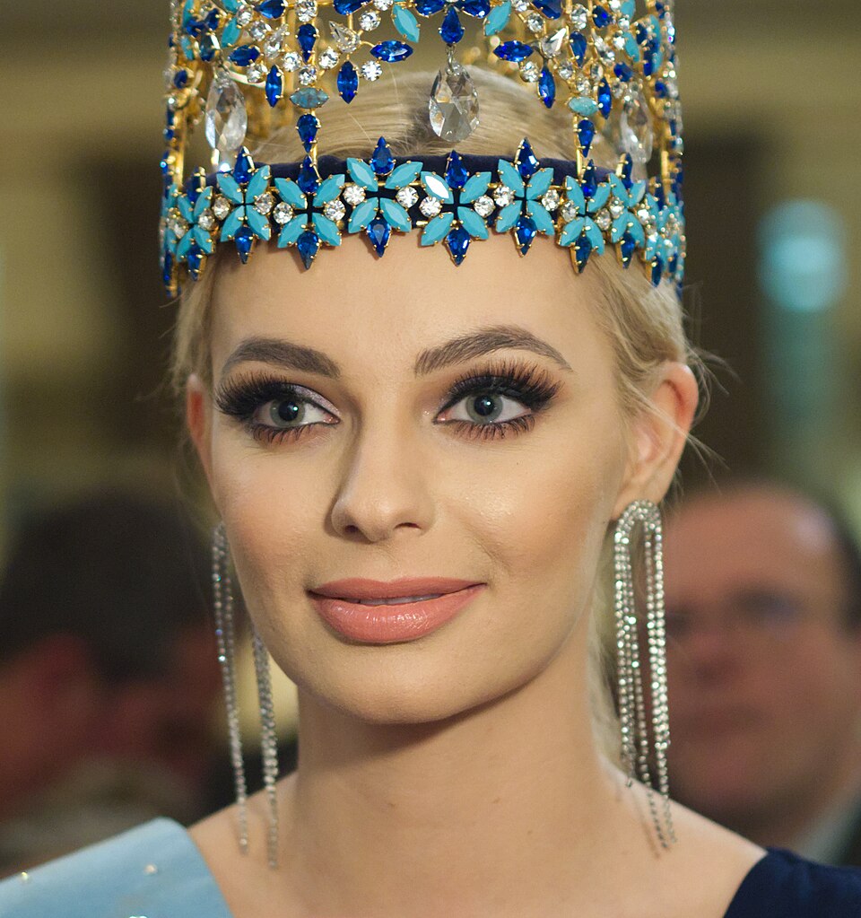Close portrait of Karolina Bielawska wearing the jewelled blue-and-gold Miss World crown