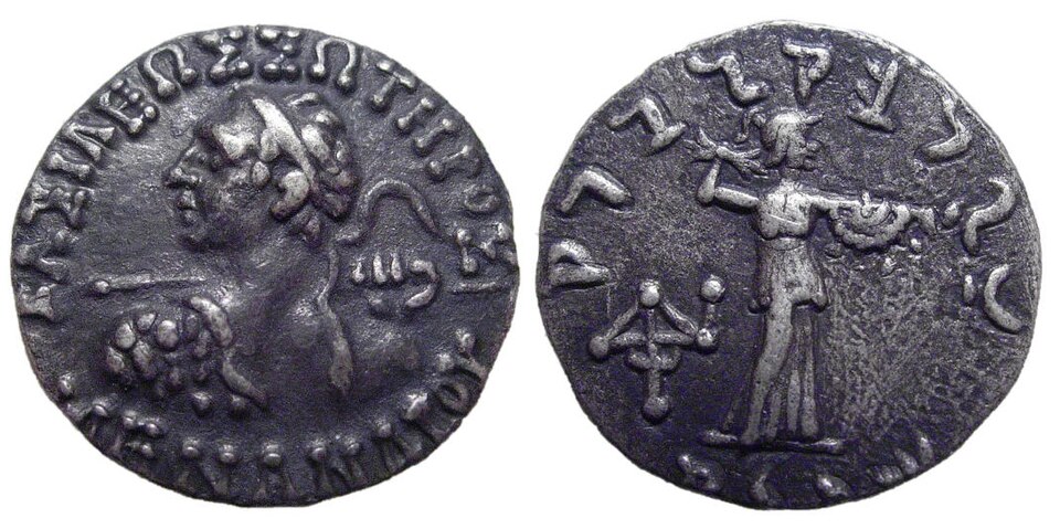Two faces of a silver drachm of the Indo-Greek king Menander I: a helmeted royal bust with a Greek legend on the obverse and the goddess Athena hurling a thunderbolt with a Kharoshthi legend on the reverse