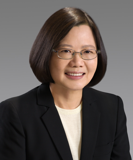 Studio portrait of Tsai Ing-wen wearing glasses and a dark blazer