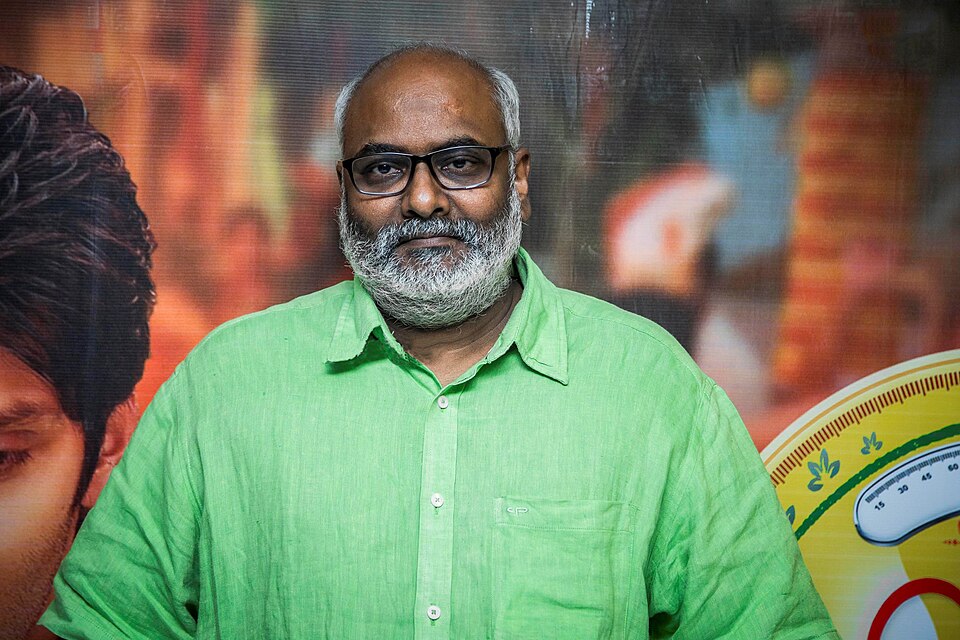 Music composer M. M. Keeravani in a green shirt and dark-framed glasses at a film event