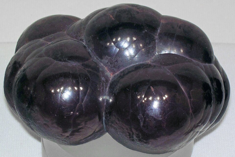 A shiny dark botryoidal (kidney-ore) hematite iron-ore specimen with rounded bulbous lobes