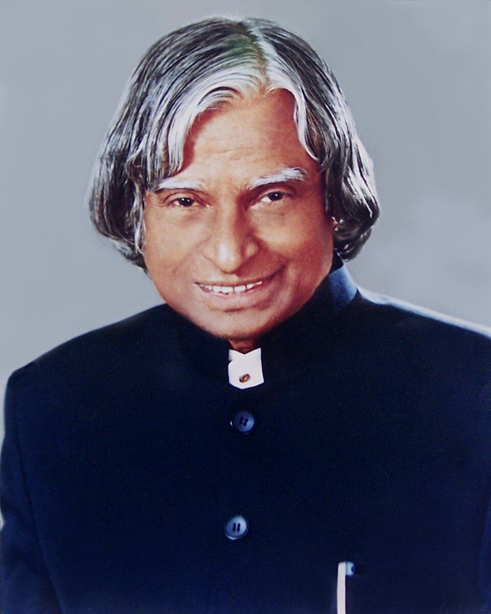 Official portrait of A. P. J. Abdul Kalam, smiling, in a dark bandhgala jacket against a plain grey background